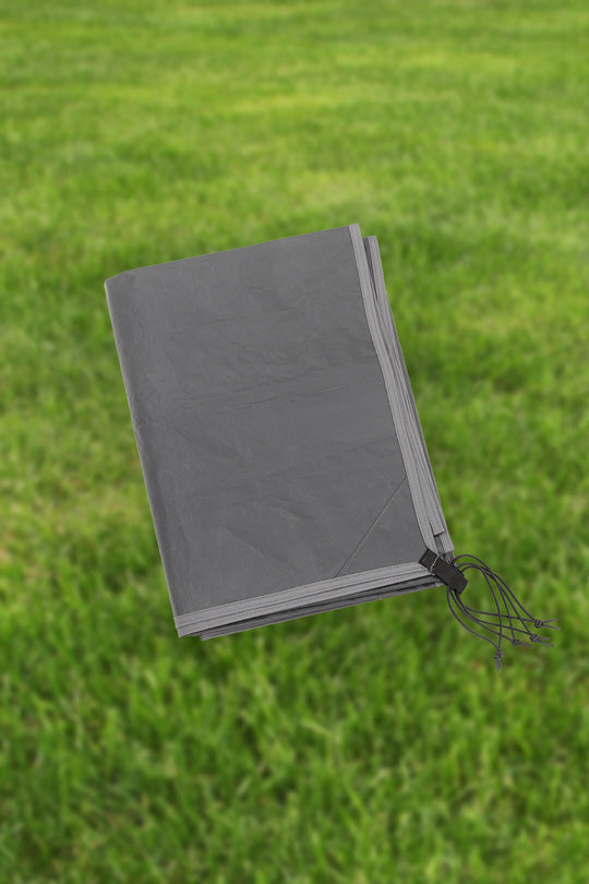 A folded footprint shown on a grassy background.