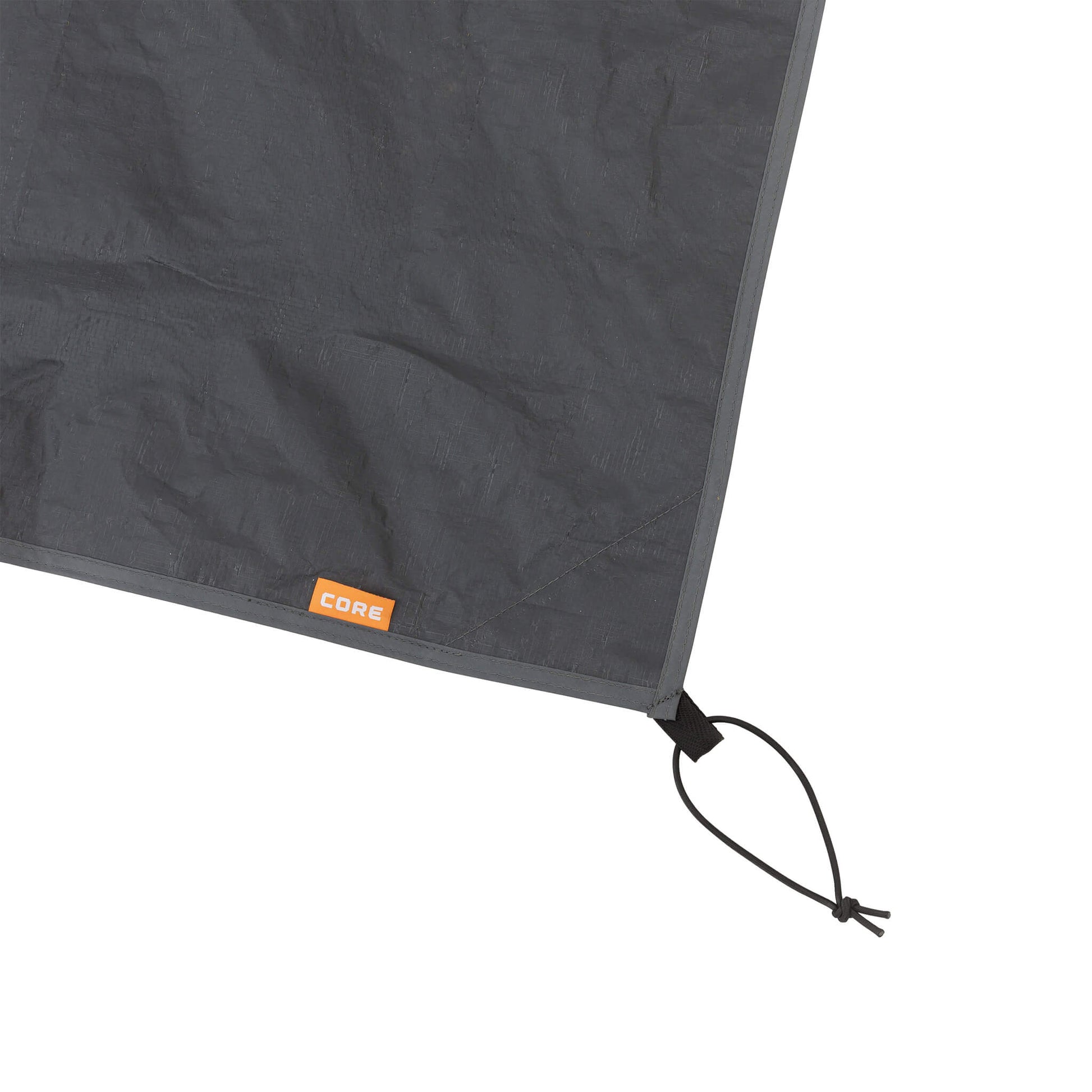 Close-up of CORE 6 person tent footprint corner with reinforced stitching and adjustable strap for secure setup.
