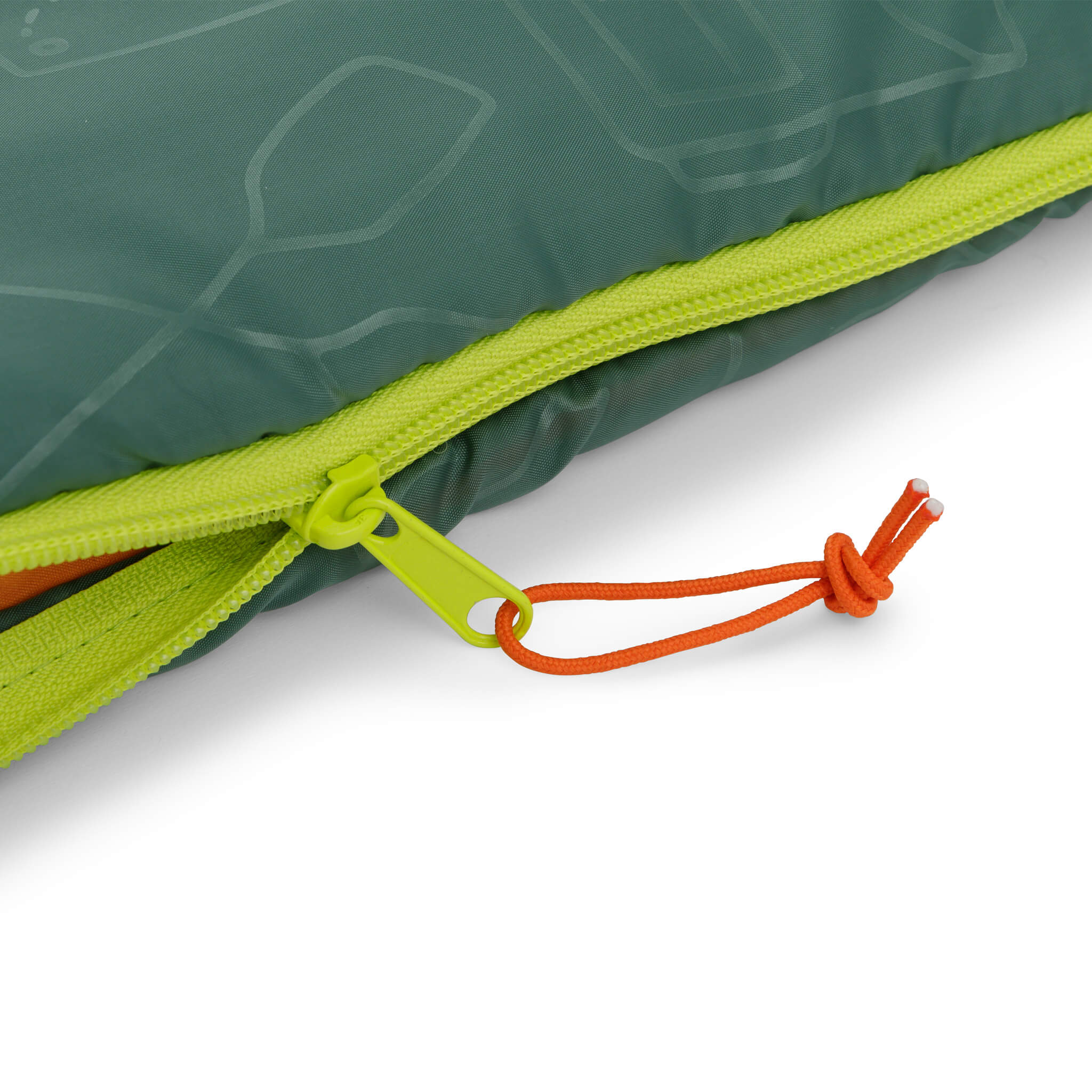 Close-up of green CORE Youth sleeping bag zipper with orange pull cord.
