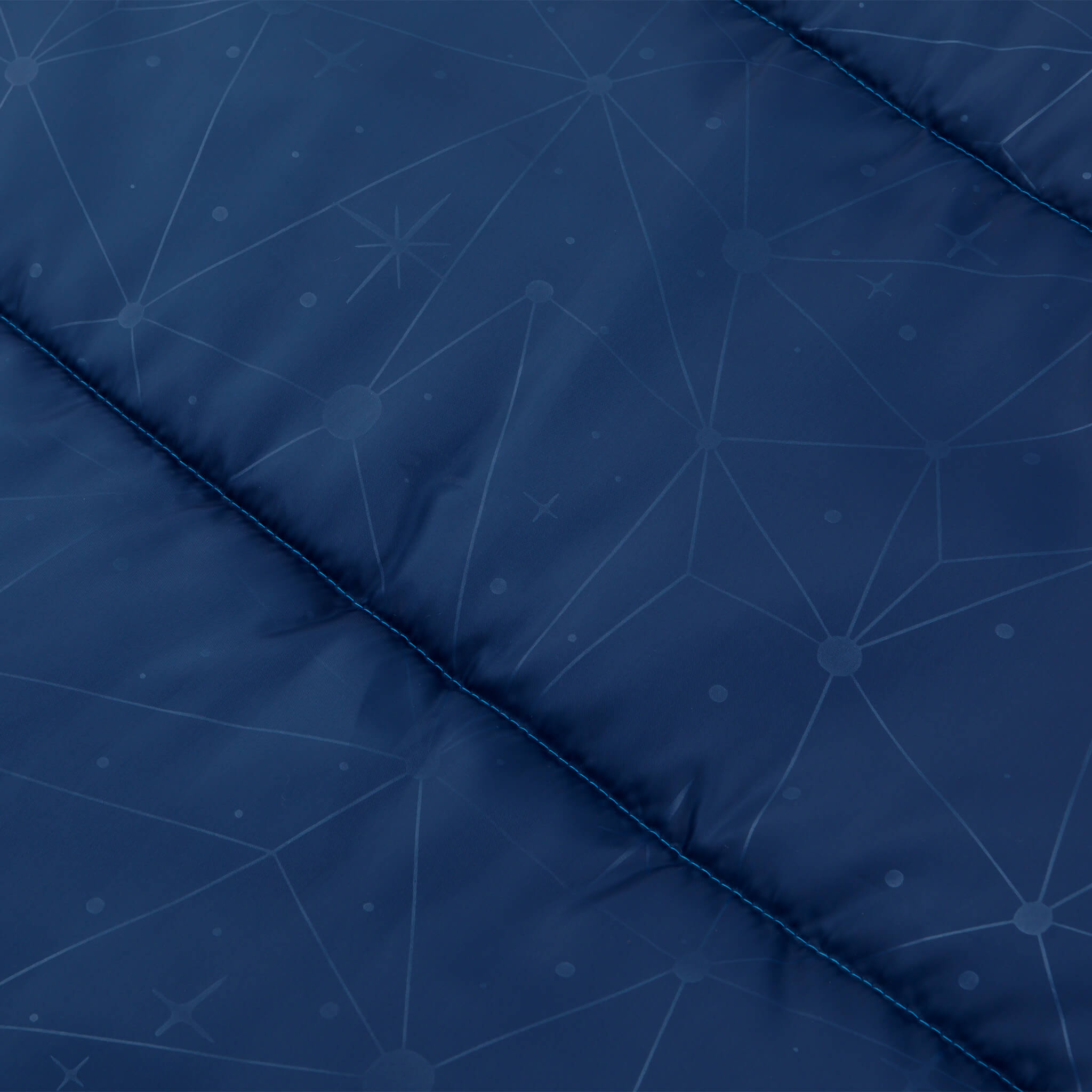 Close-up of blue CORE Youth sleeping bag fabric with fun printed galaxy pattern.