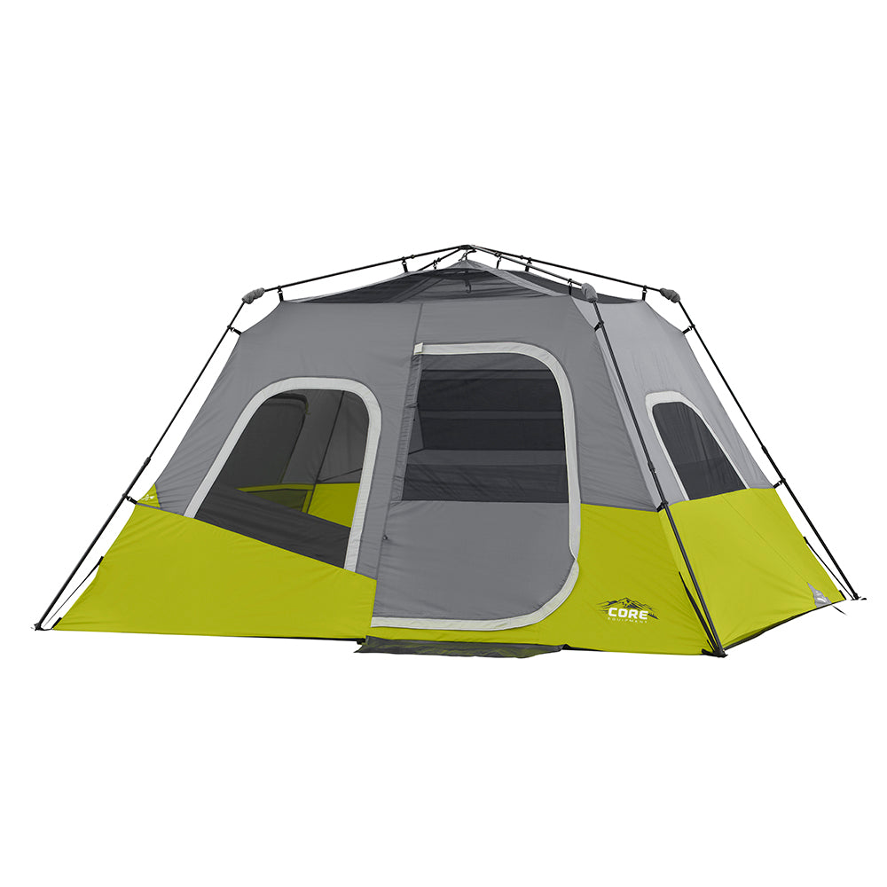 A CORE 6 Person Instant Cabin Tent with a gray and green exterior. The tent a large door and multiple mesh windows for ventilation. The CORE brand logo is displayed on the side. The tent has a rectangular shape with a peaked roof supported by visible poles.
