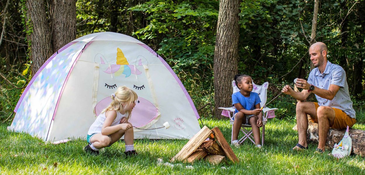 Kids enjoying a campsite next to the Firefly! Sparkle the Unicorn Kid's Tent.