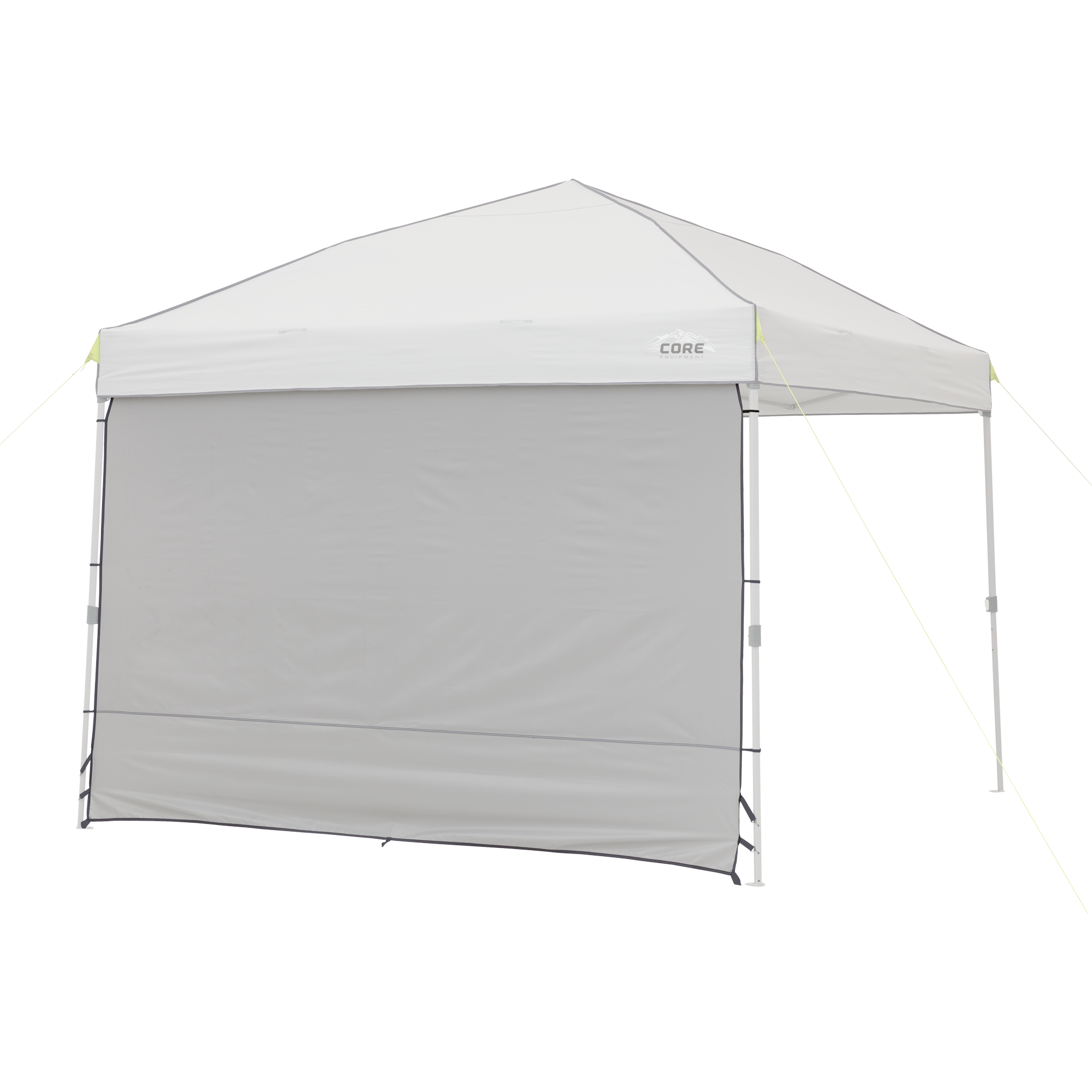 The 10' x 10' Sun Wall Accessory from CORE consists of a gray canopy tent with a triangular roof and a single gray sidewall. The sidewall extends from the top to the ground, providing shade and privacy. The canopy structure is supported by four legs, with ropes attached to the corners for stability.