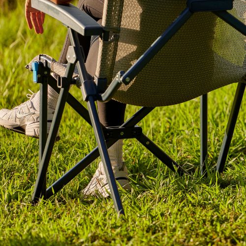 Person sitting in a CORE Stretch Knit Hard Arm Chair.