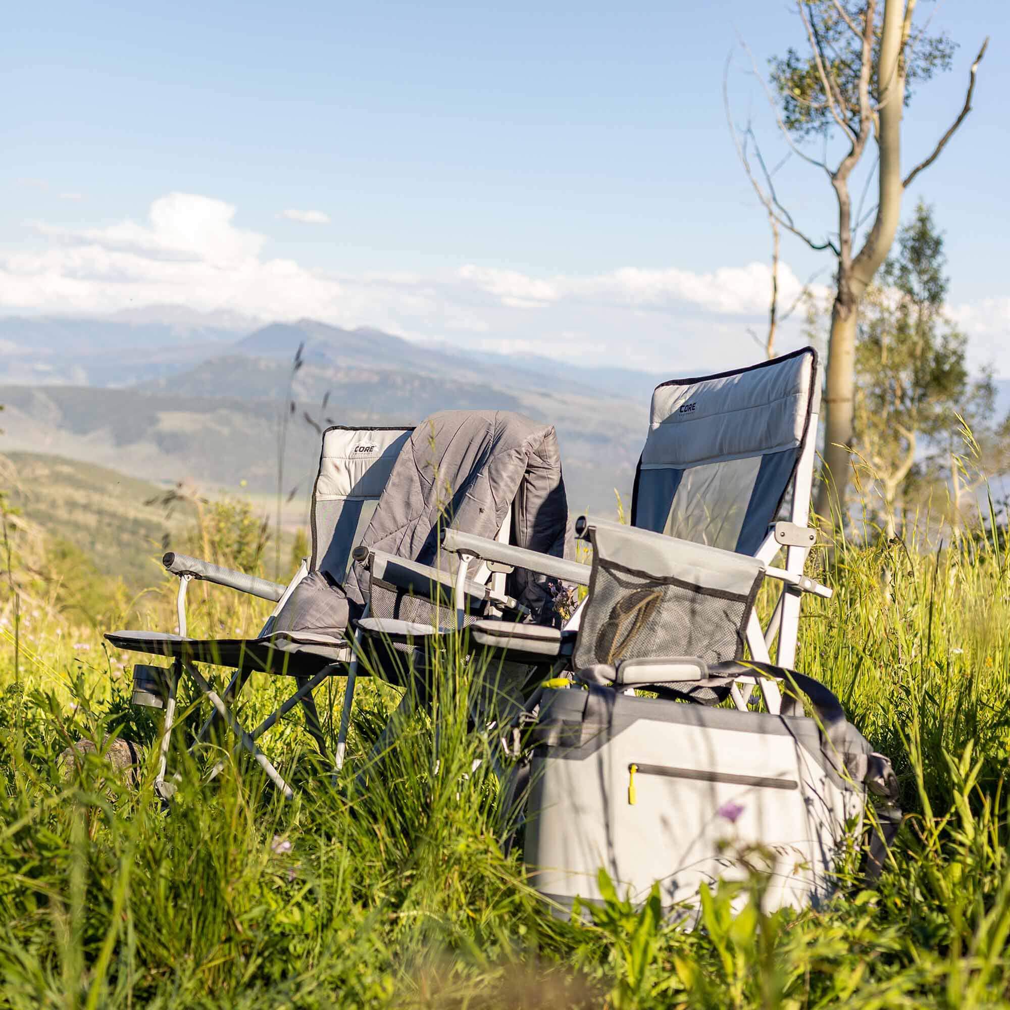CORE 12 can performance tote cooler in gray shown outdoors beside camp chairs, ideal for keeping drinks cold on trips.