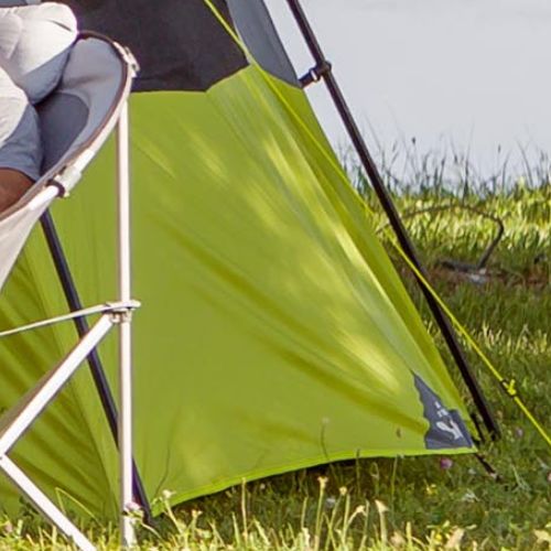 Close-up of a CORE 12 person instant tent ventilation showing durable green fabric, reinforced seams, and guyline attachment set up on grass.
