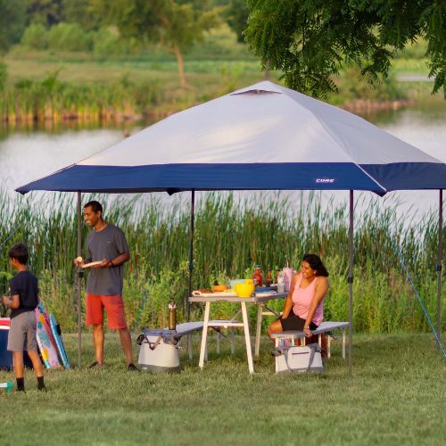 People relaxing under a CORE 13x13 canopy. 