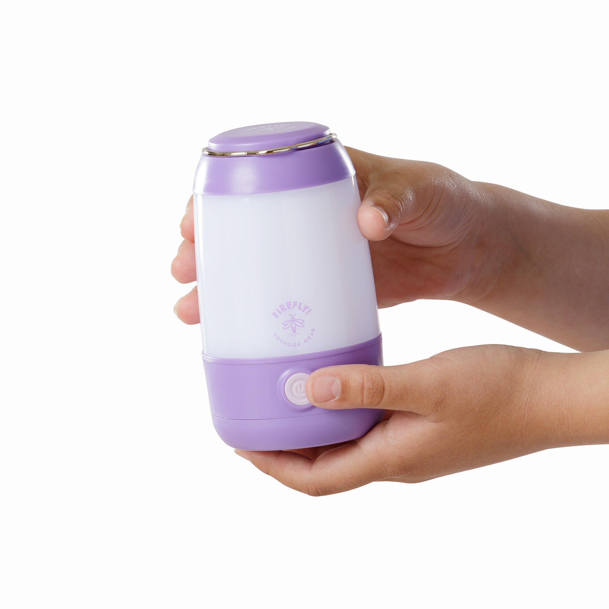 Hand holding a purple and white 200 lumen lantern.