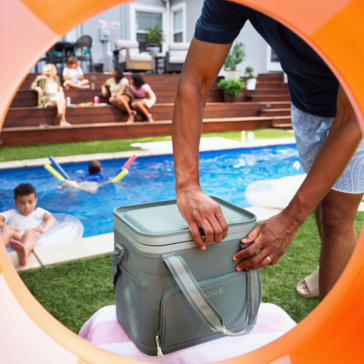A person opening the CORE 24 can Flipback cooler.
