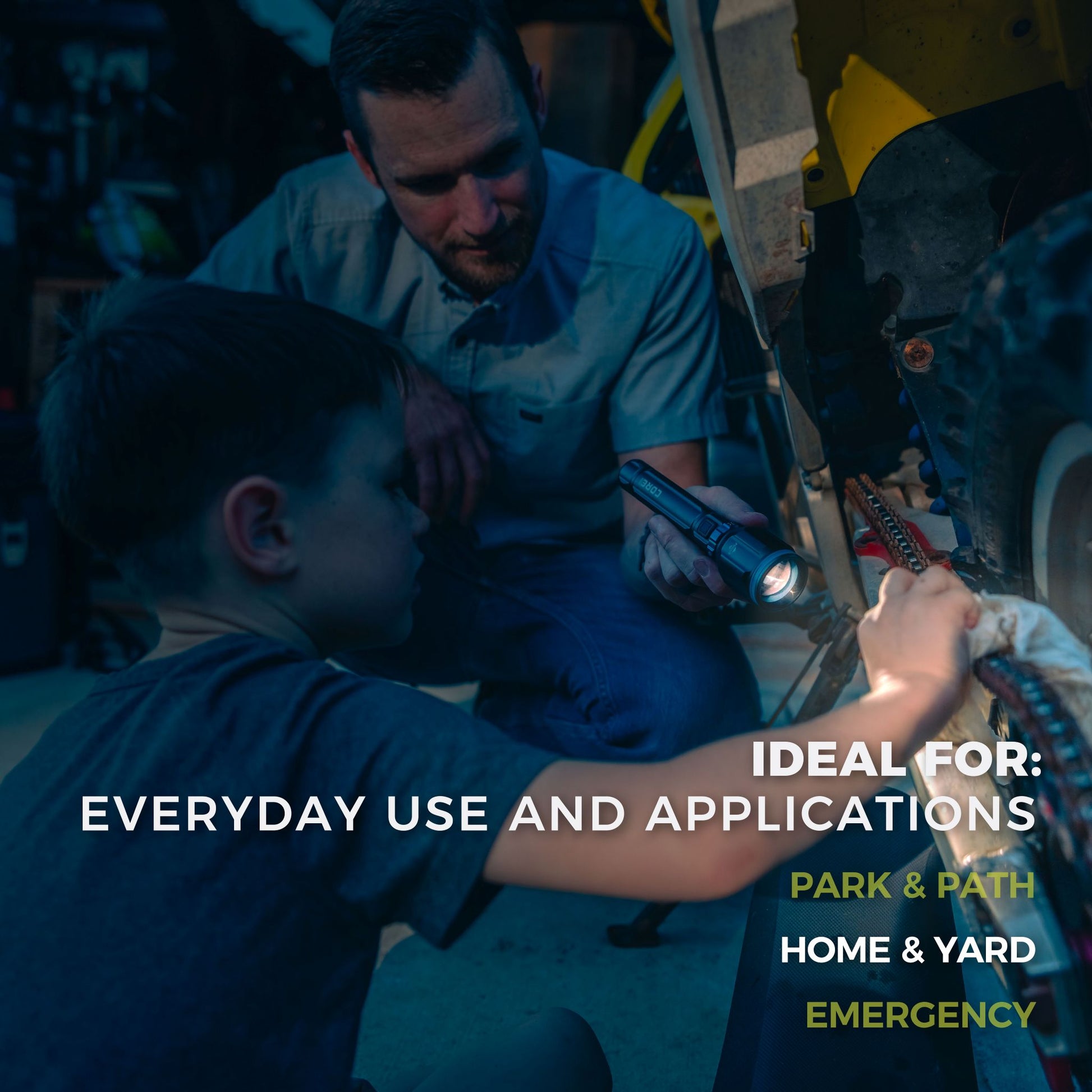 A father and son working on a bike using the CORE 3000 lumen rechargeable flashlight.