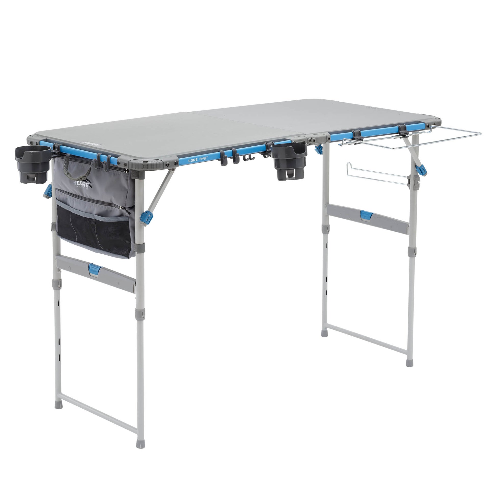 CORE folding cook table with prep table top, trash bag holder, cup holders, and accessory bag attached.