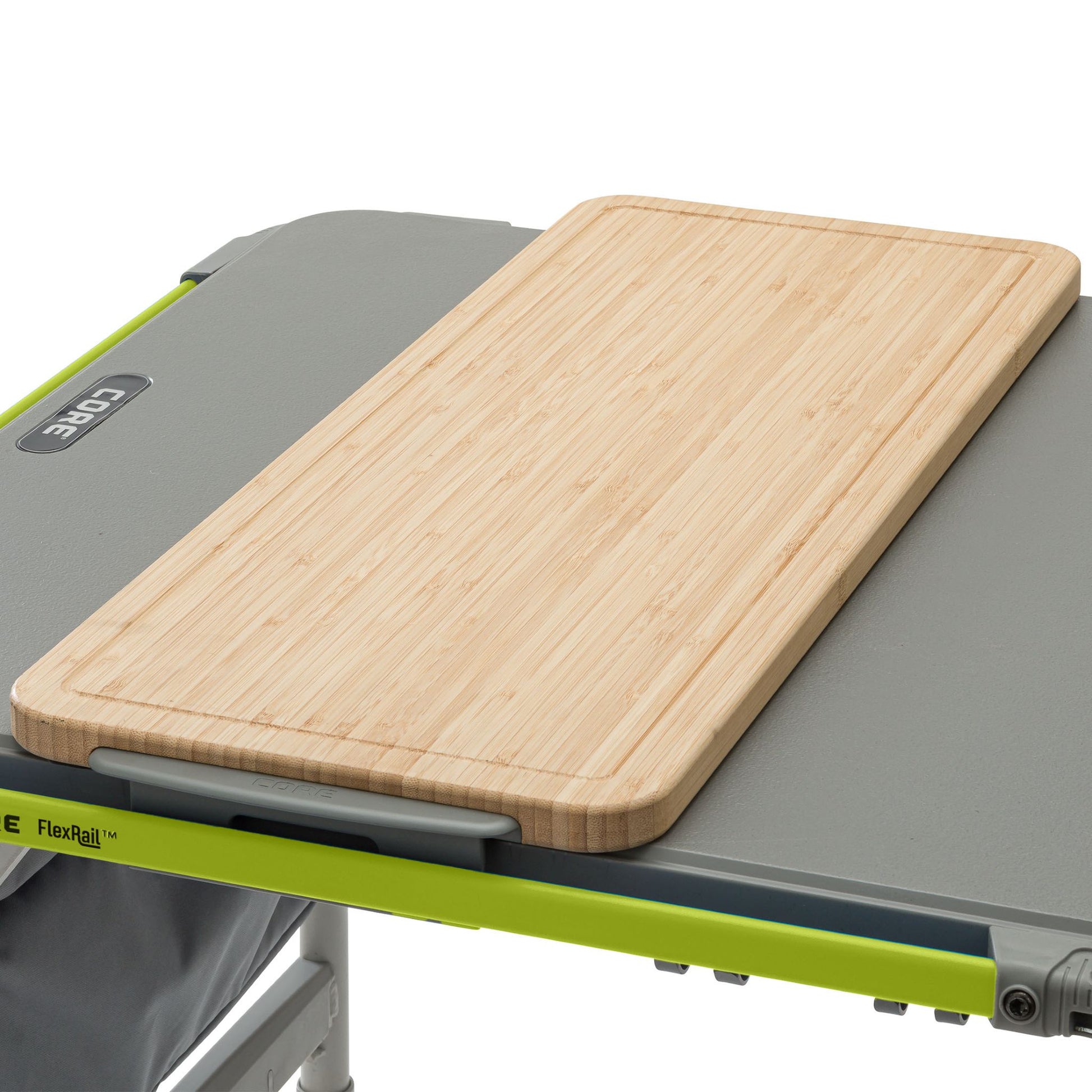 Wooden cutting board on a portable camping table with a white background
