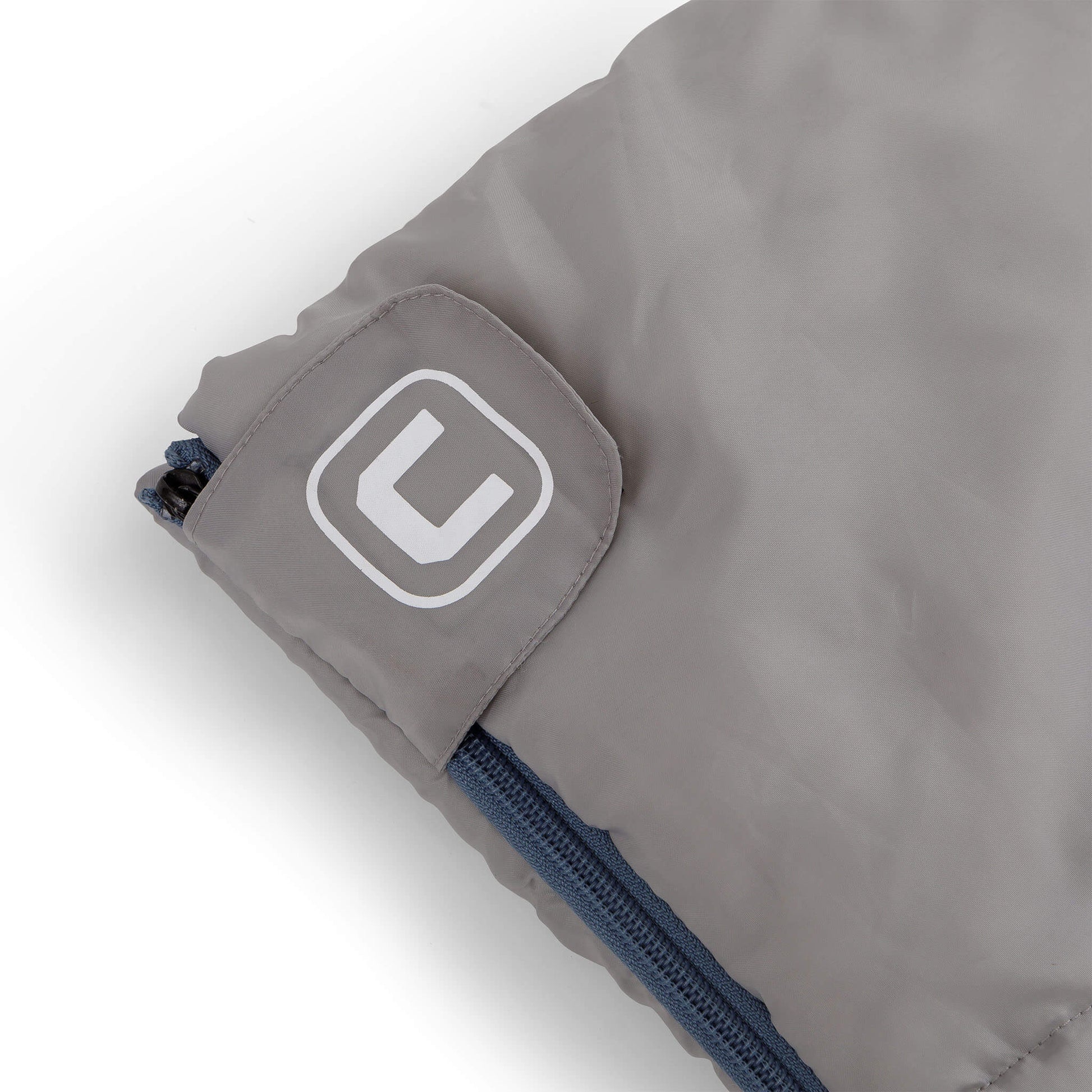 Close-up of CORE sleeping bag logo patch on zipper cuff.