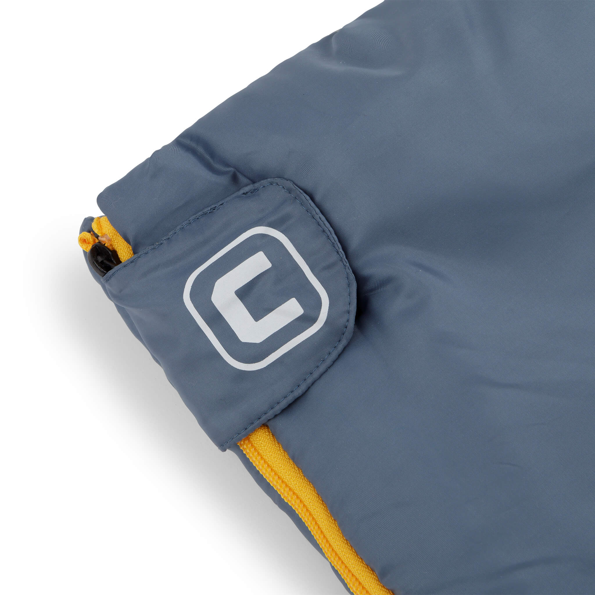 Close-up of CORE sleeping bag logo patch on zipper cuff.