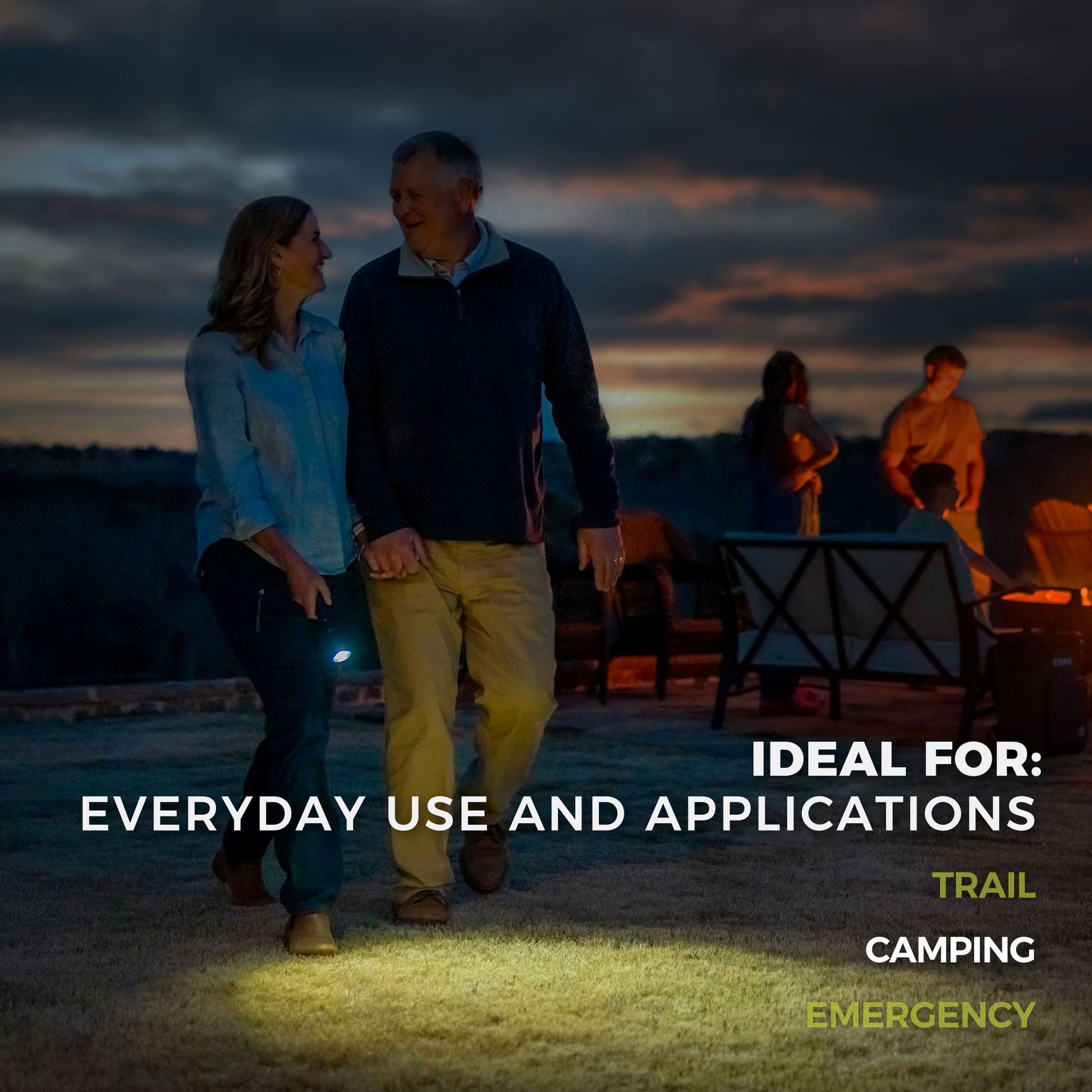 A man and woman walking together with a CORE 5000 lumen rechargeable flashlight, surrounded by people.
