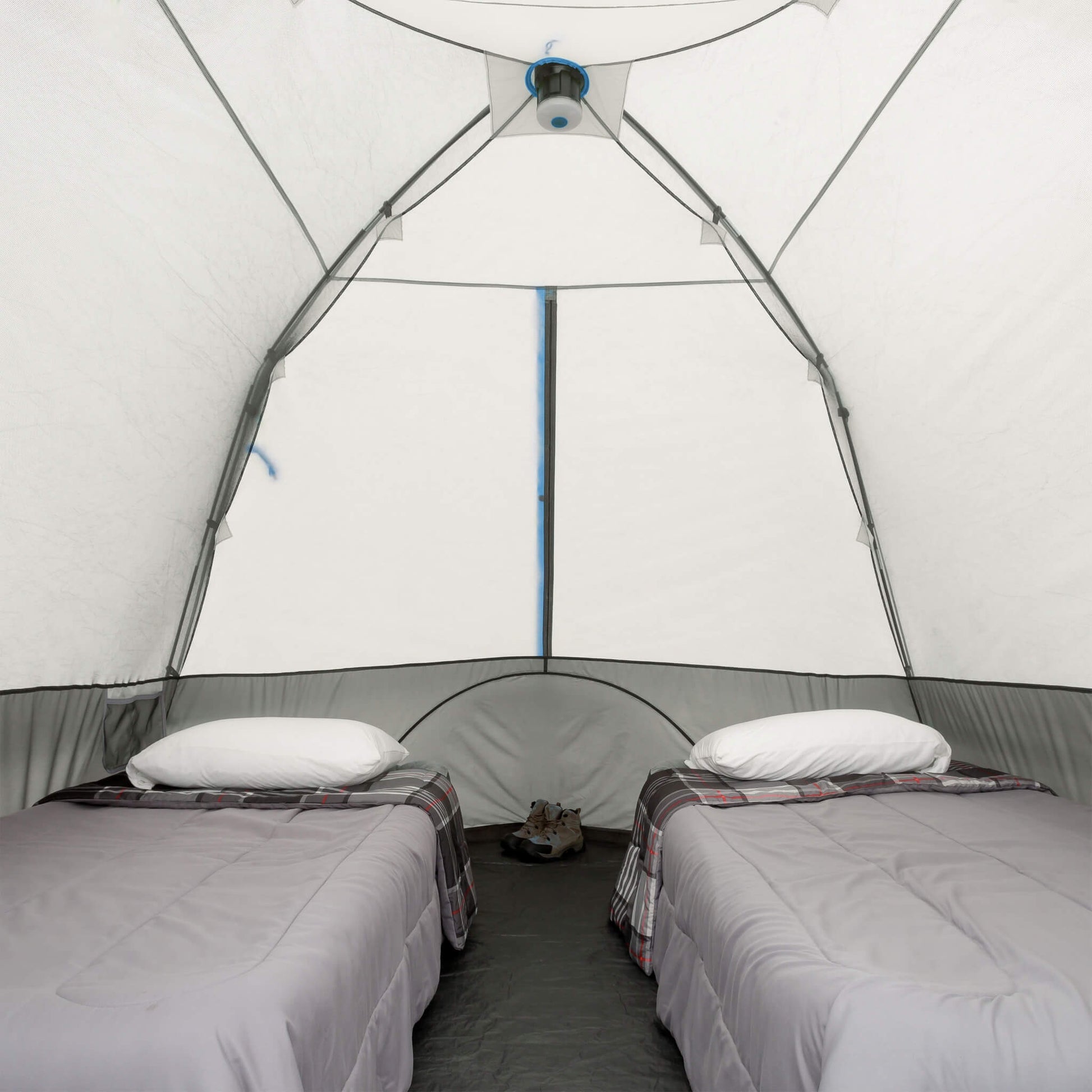 Inside CORE 6 person lighted dome tent with two cots in spacious sleeping setup.
