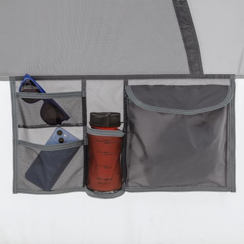 Close-up of storage pocket on CORE 9 person lighted instant cabin tent with full rainfly.