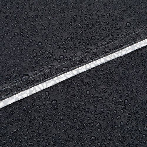 Close-up of CORE tent fabric showing water beading on weather-resistant material with sealed seam detail for rain protection.