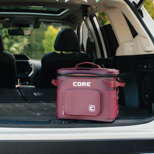 A maroon-colored 18-can soft cooler with 'CORE' branding in a car trunk.