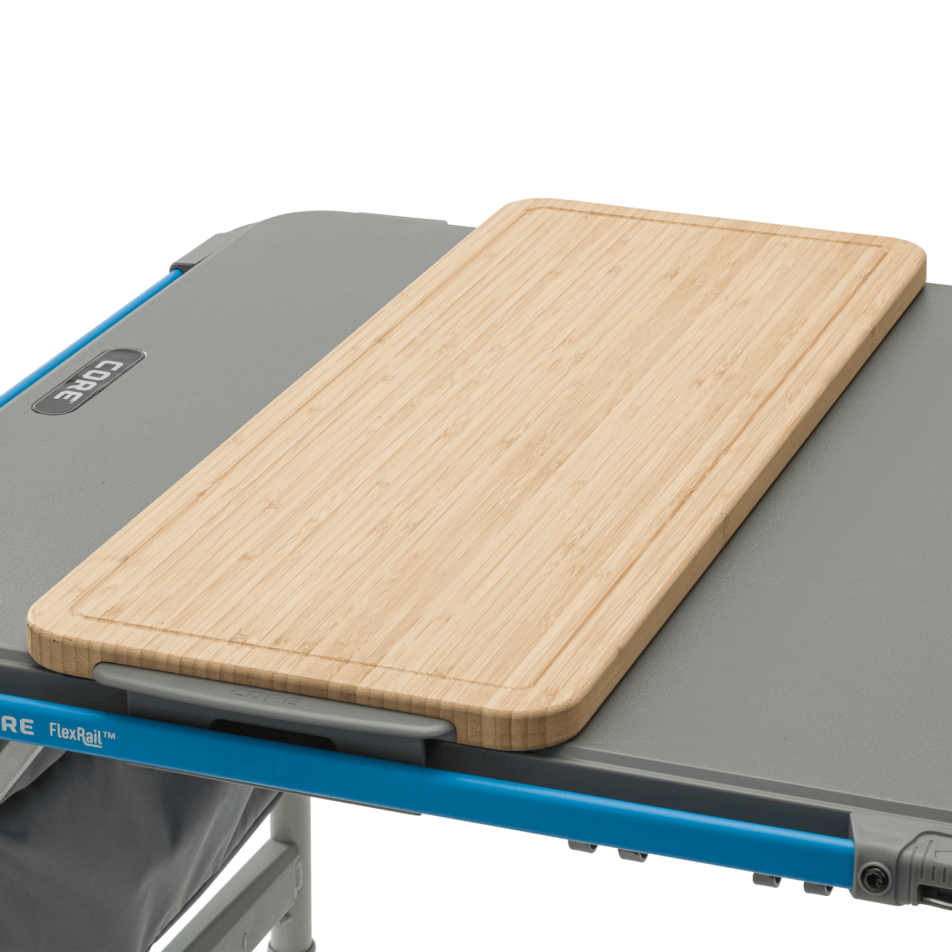 CORE bamboo cutting board accessory on camp kitchen table, designed to fit the 4 Foot FlexRail table for outdoor meal prep convenience.