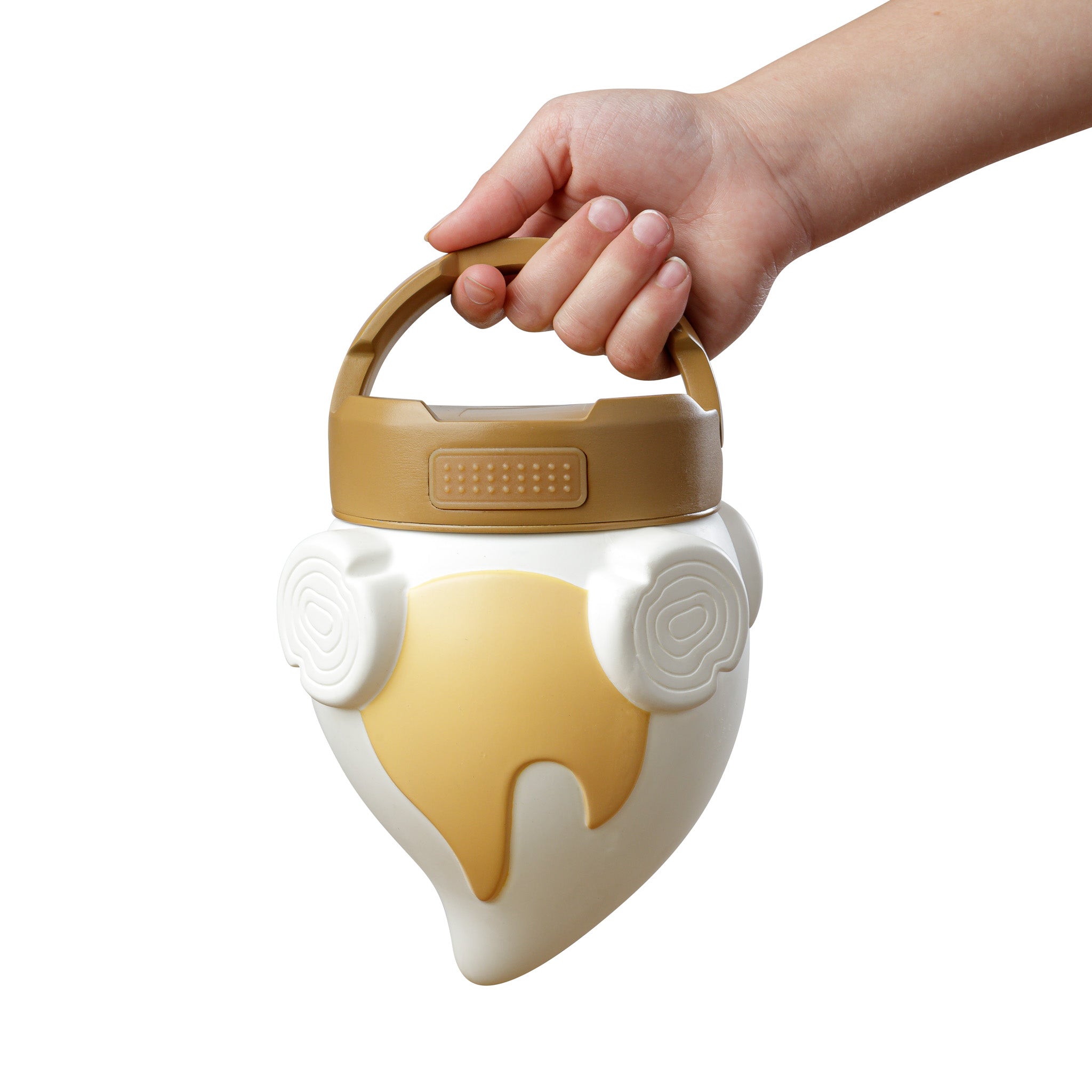 Campfire-shaped lantern with a hand holding it's handle on a white background.