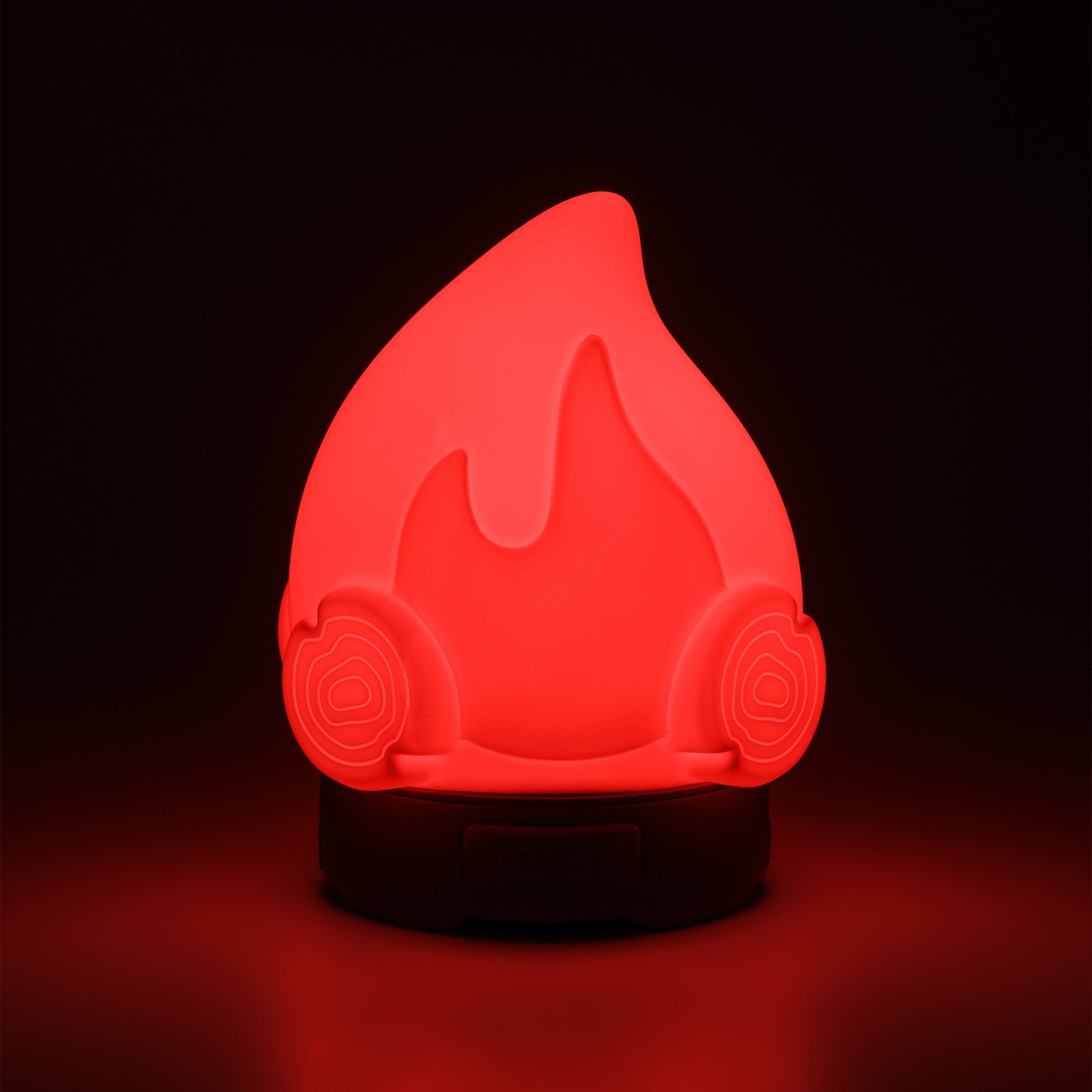 Red flame-shaped lamp on a black background.