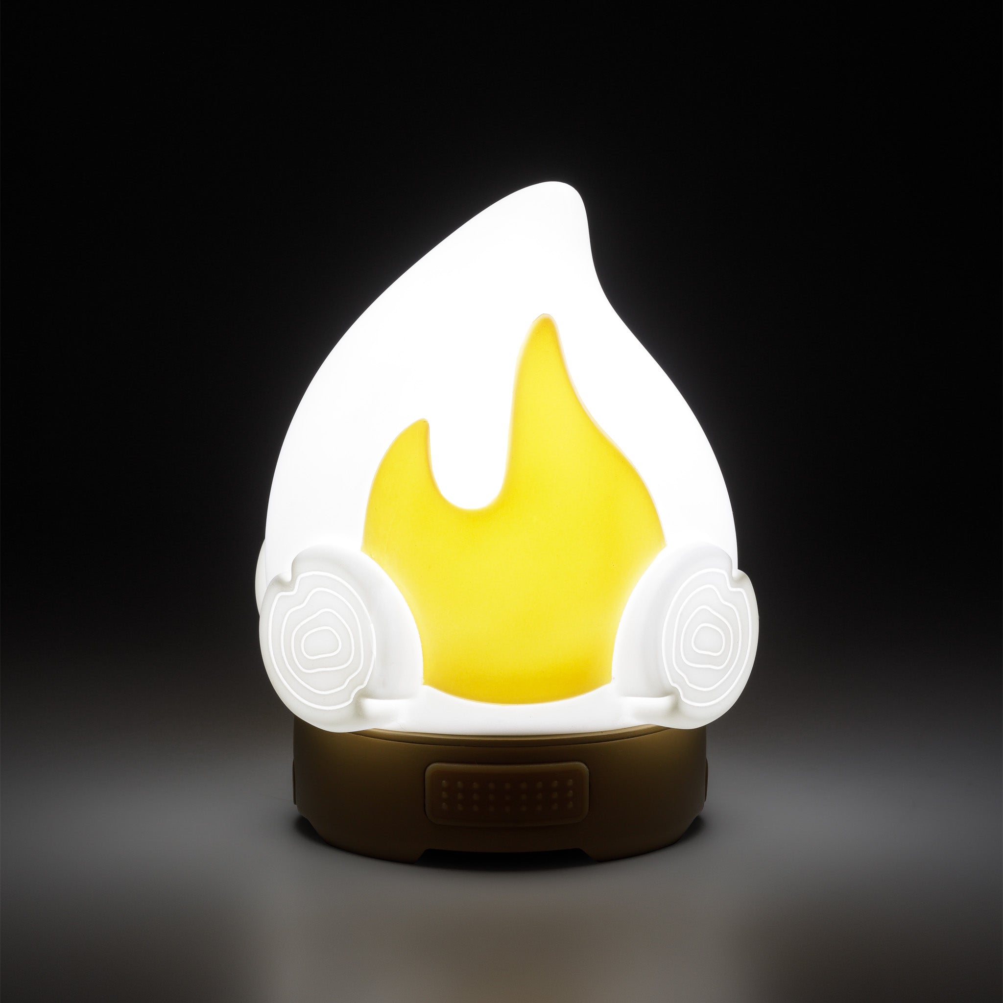 White flame-shaped lamp on a black background.