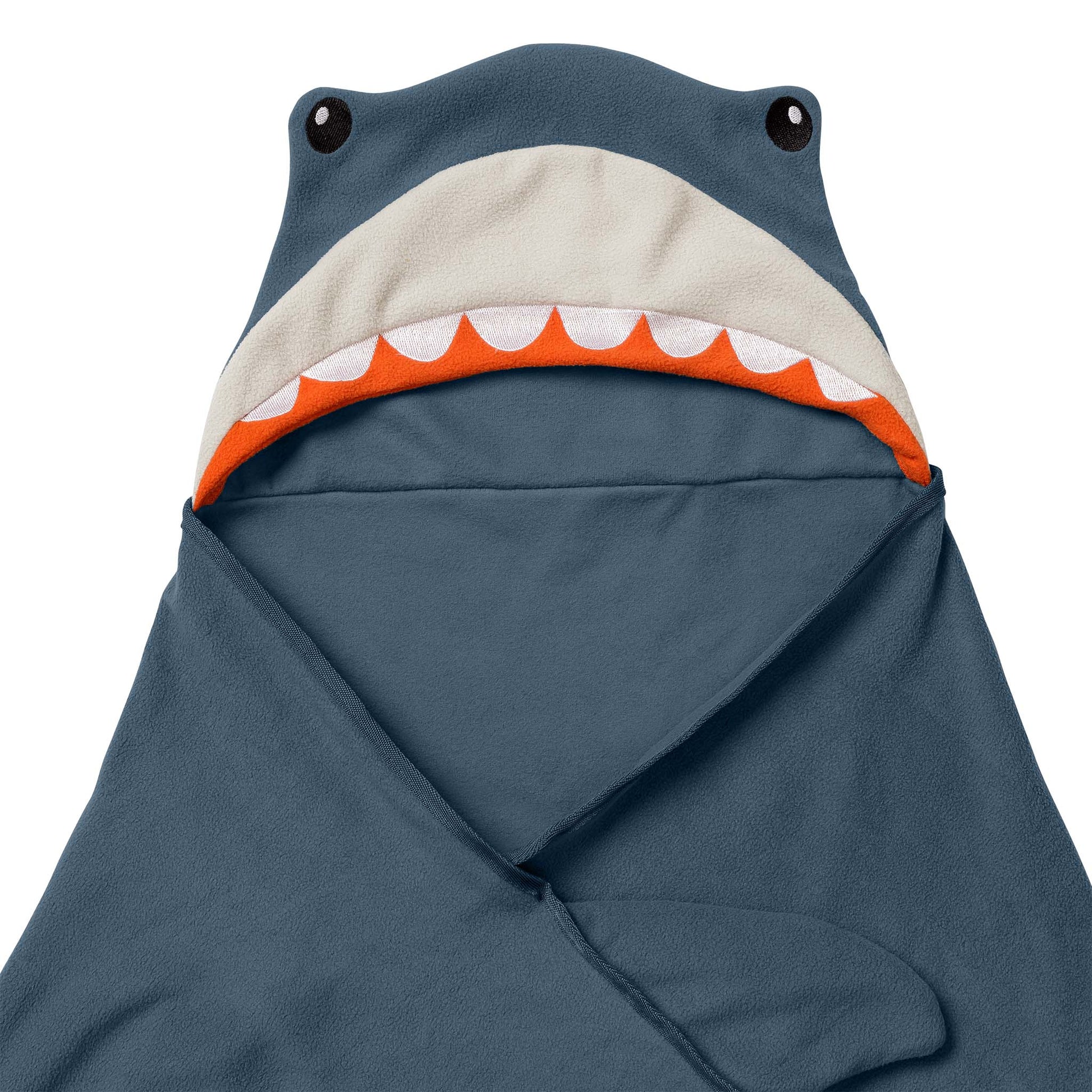 Close-up of a shark-themed blanket, partially folded. 