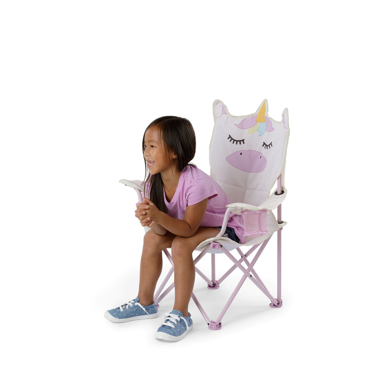 A kid sitting on a folding camp chair with a unicorn-themed backrest.