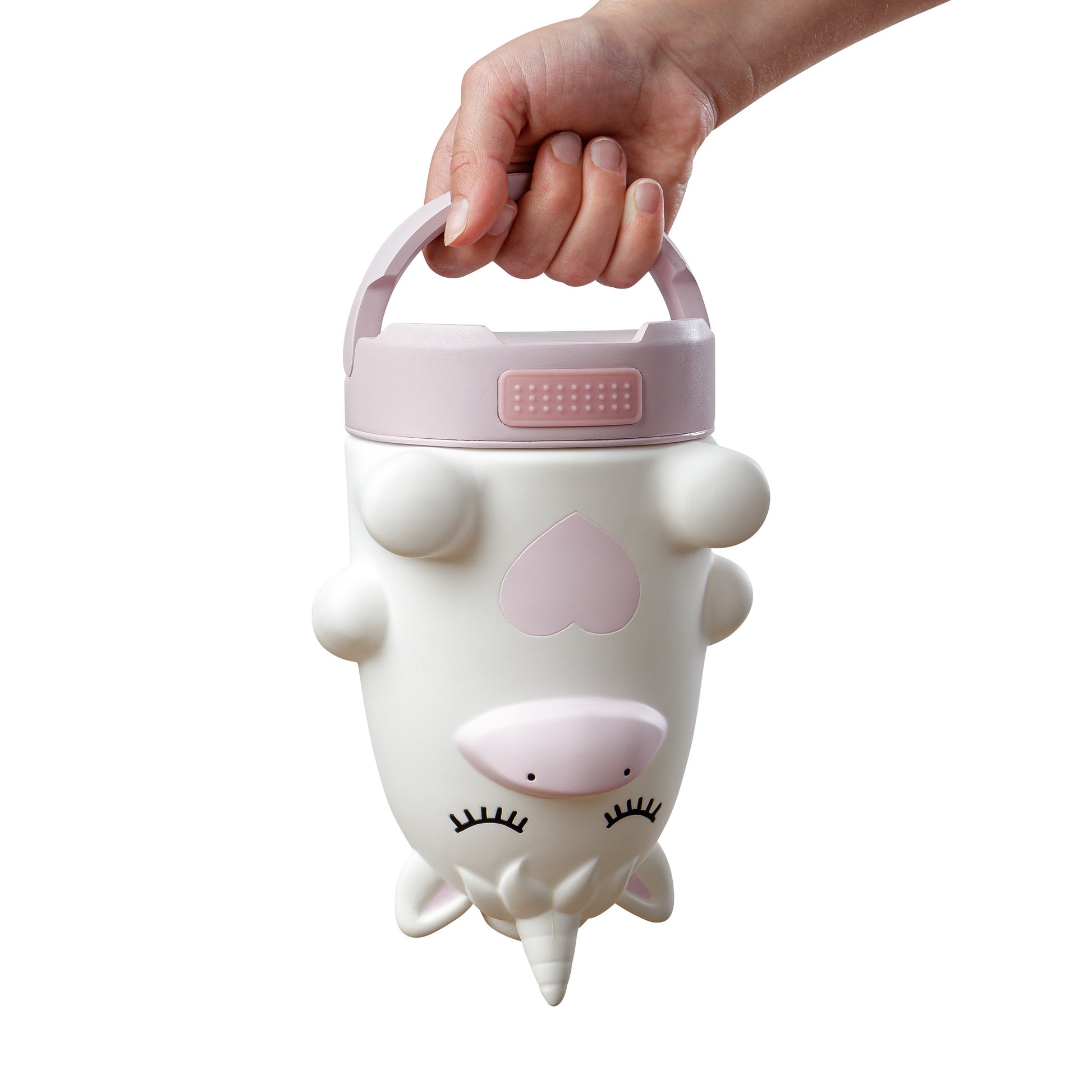 Unicorn-shaped lantern with a hand holding its handle on a white background.