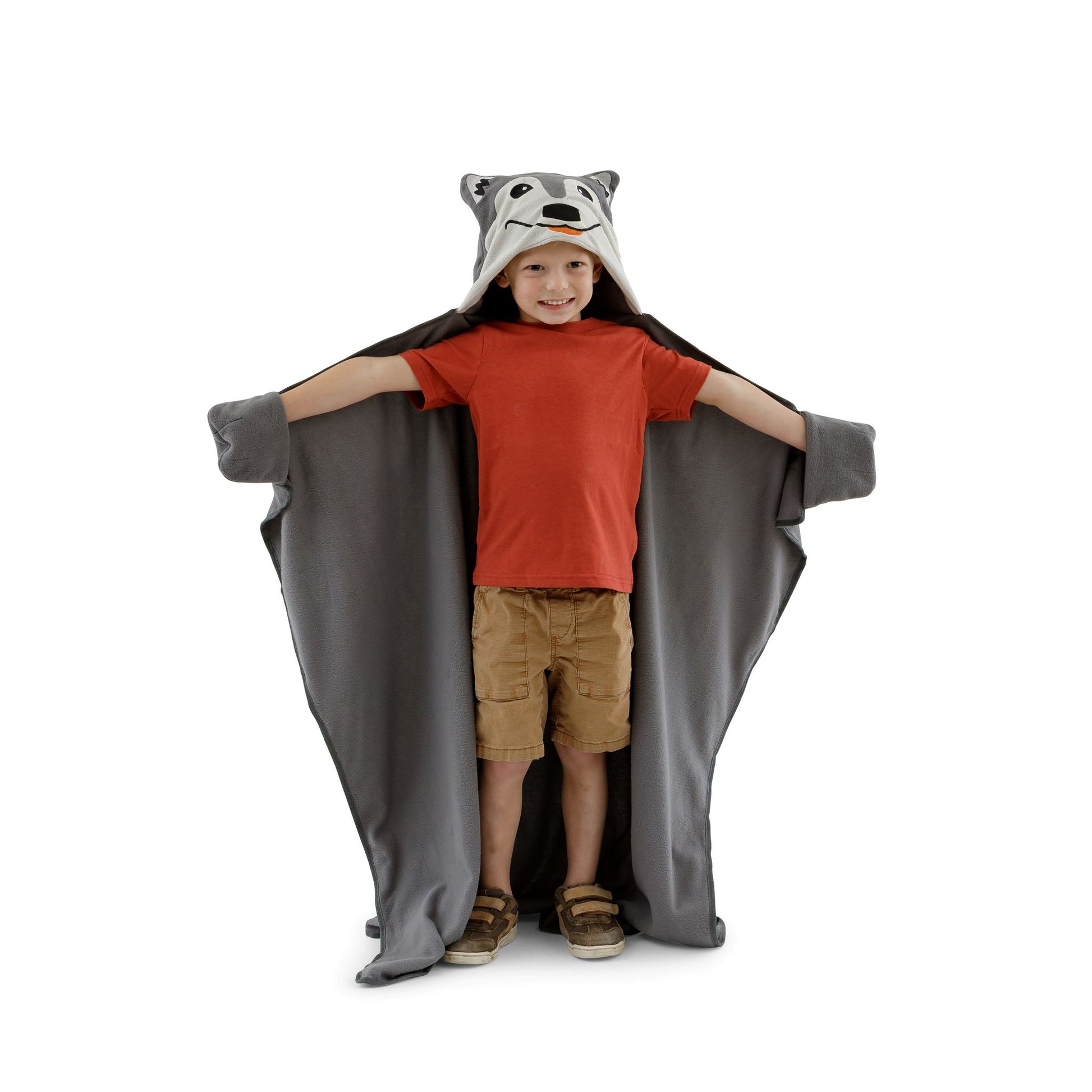 A child wearing a wolf blanket on a white background.