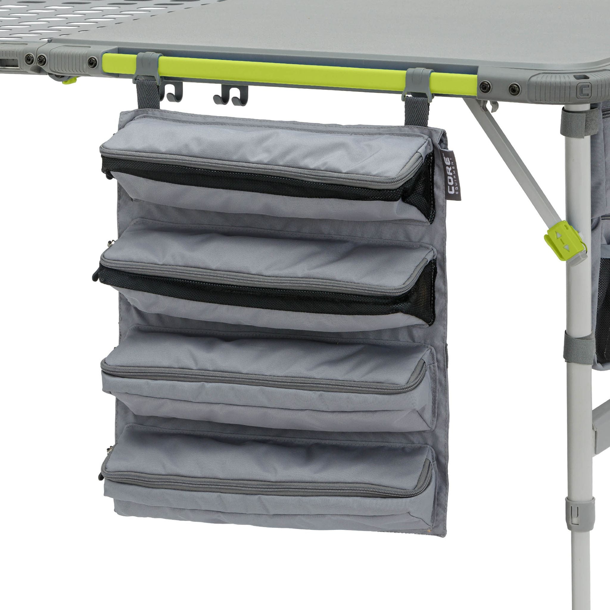 Gray hanging organizer attached to a camping table with green accents
