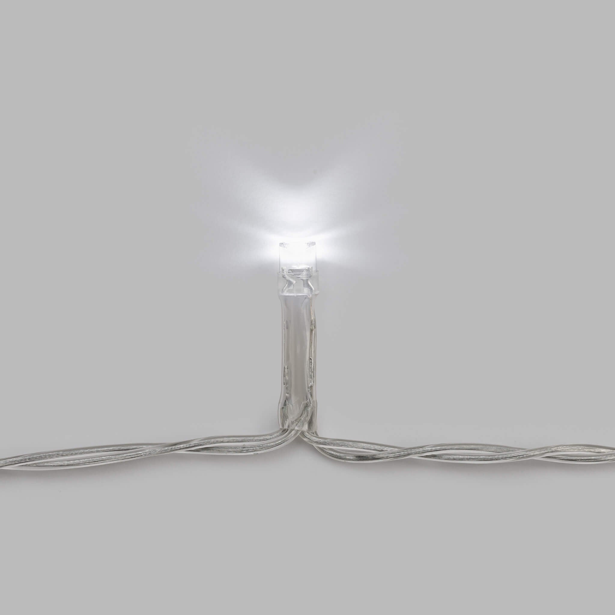 CORE camping string lights shown in low mode with softer LED glow for ambient camp or backyard lighting.