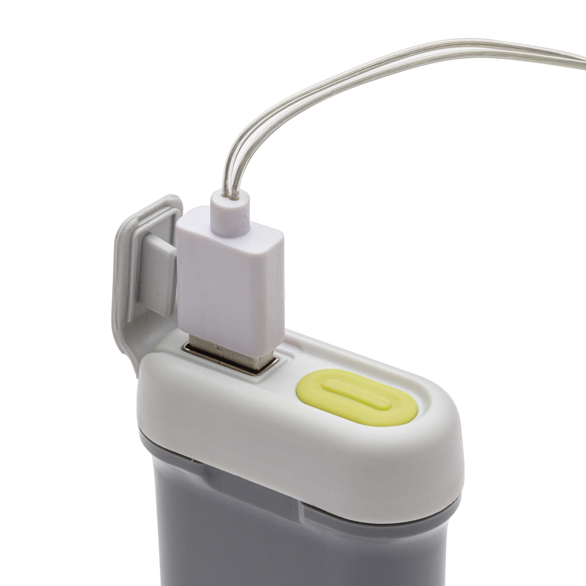 CORE string lights battery pack close-up with neon green power button for easy switching between high and low settings.