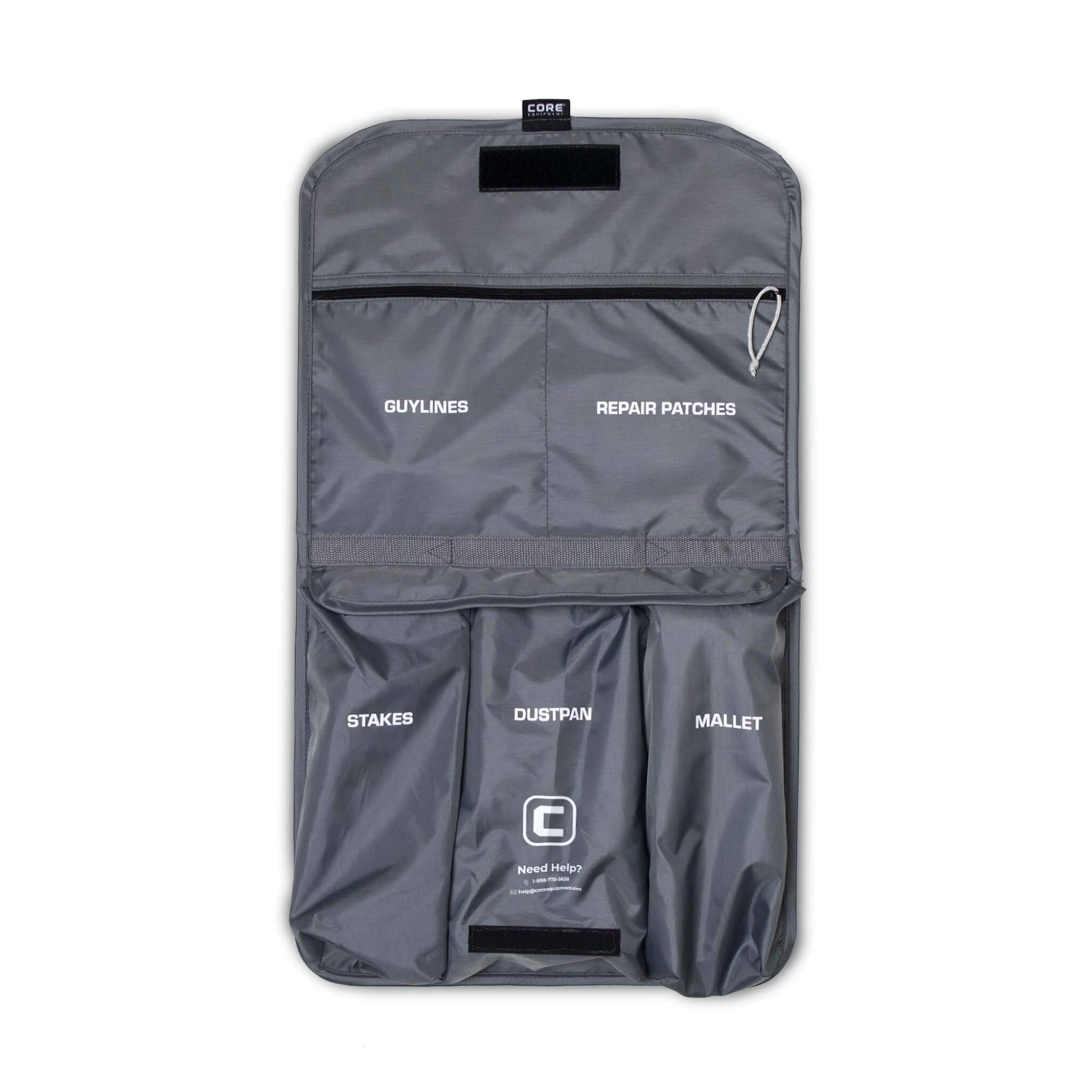 CORE tent kit hanging storage bag with labeled compartments for mallet, stakes, guylines, and small tools.