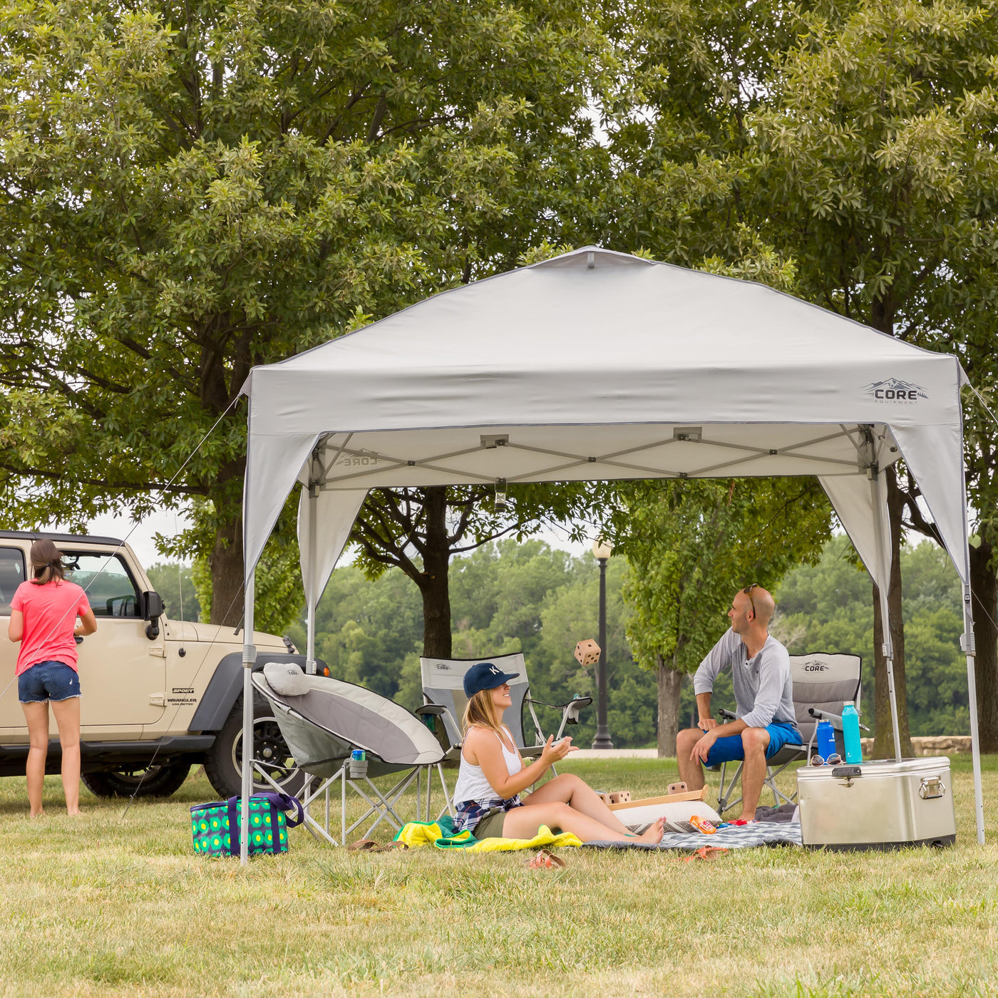 Core Equipment 10x10 Instant Canopy lifestyle image of friends in a park