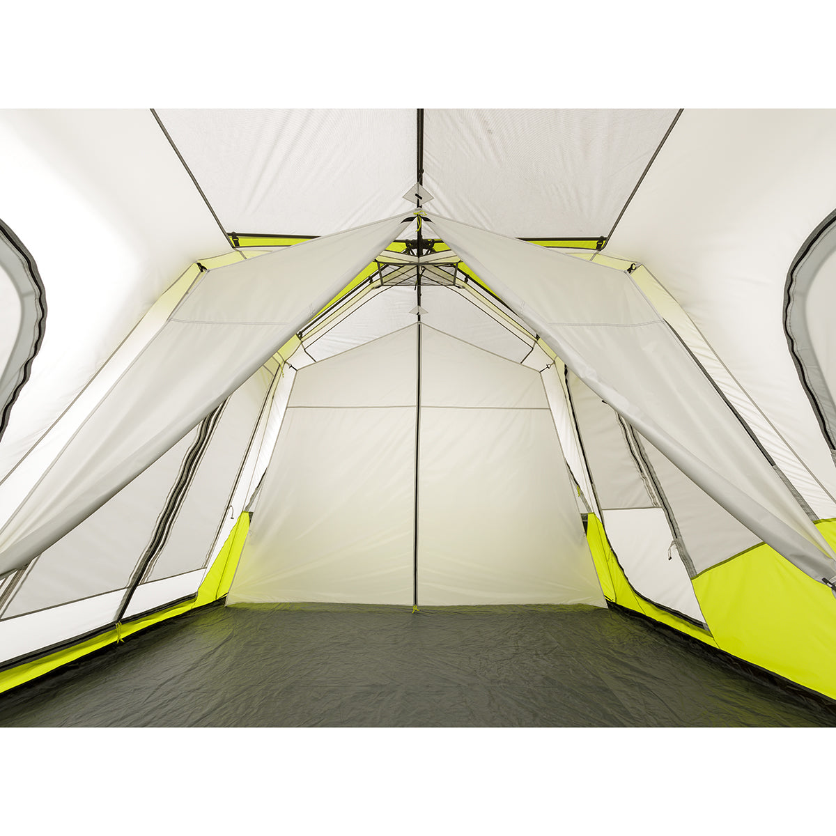 Interior view of a spacious, empty 12 Person Instant Cabin Tent with a white and green color scheme. The CORE tent features mesh windows on the sides and a black floor. The entrance is open, revealing a triangular doorway and additional space inside.