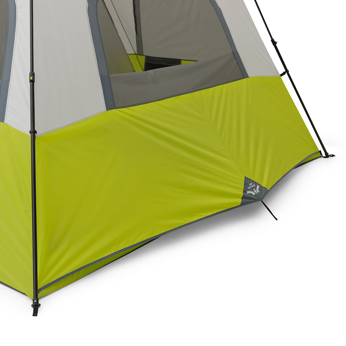 Close-up of the lower section of a green and gray 12 Person Instant Cabin Tent by CORE, showing the stake and anchoring system that secures it to the ground. The tent has a gray top, with the rest mainly in green, featuring a logo near the bottom edge.