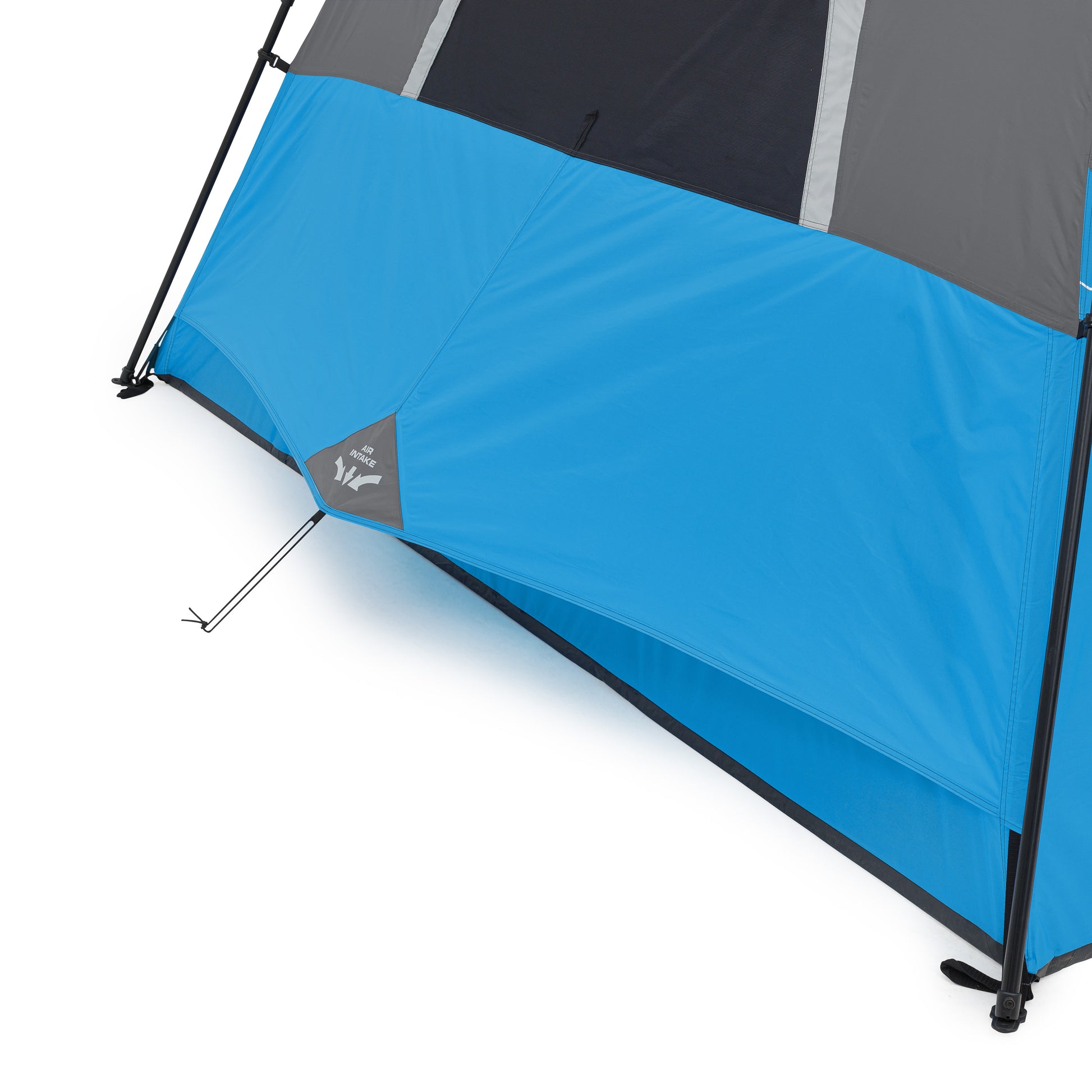 Close-up of the lower section of a blue and gray 6 Person Lighted Instant Cabin Tent by CORE, showing the stake and anchoring system that secures it to the ground. The tent has a black and gray top, with the rest mainly in blue, featuring a logo near the bottom edge.